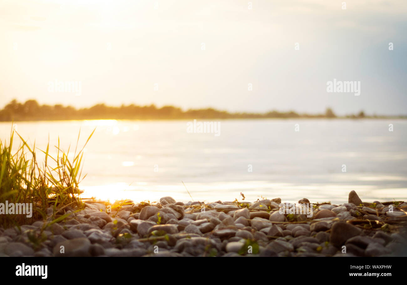 background of lake or river at sunset with warm and soft light, ideal for text backgrounds and graphic layouts Stock Photo