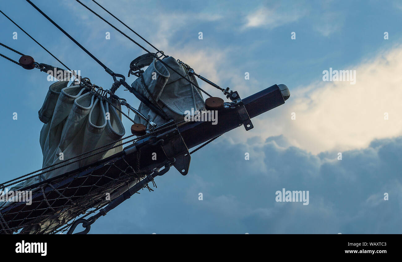 Jib boom (fore mast) in lake pier, sailing ship, clouds, wind, evening mood Stock Photo