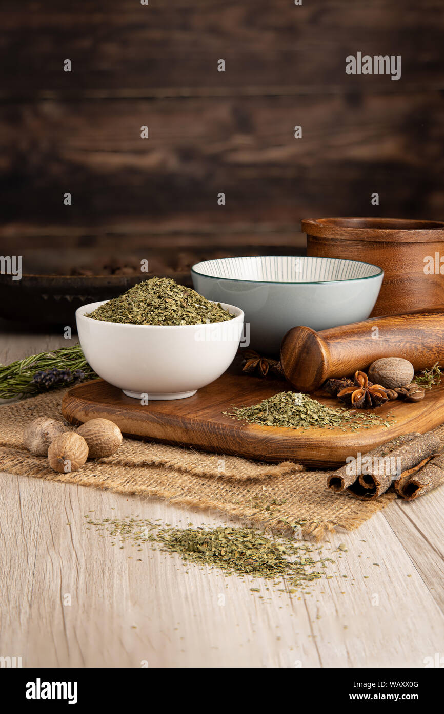 Dried Coriander Herb in a bowl and food preparation and kitchen setting