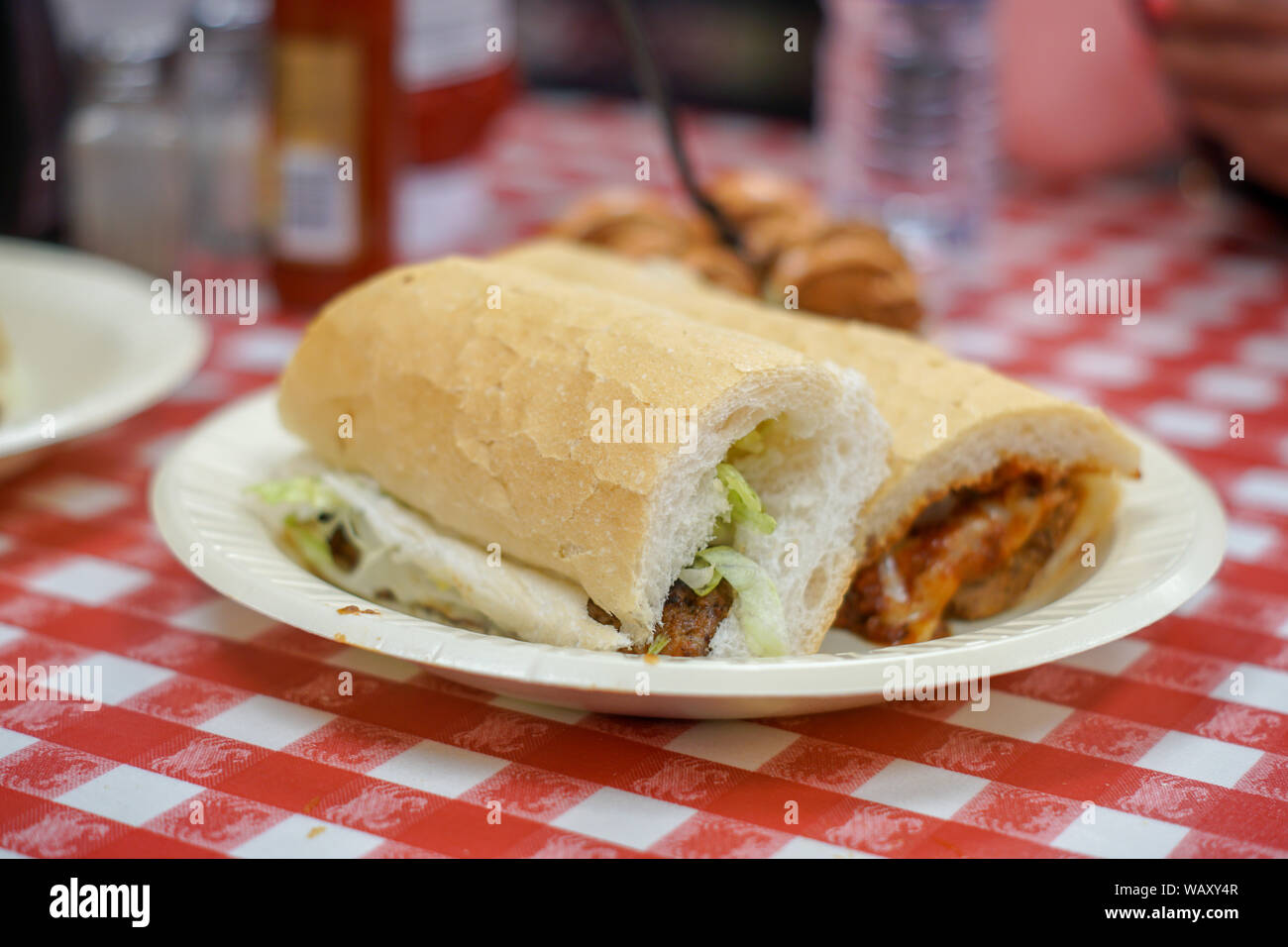 A Sausage Po' Boy Sandwich with Boudin Balls from New Orleans. Stock Photo
