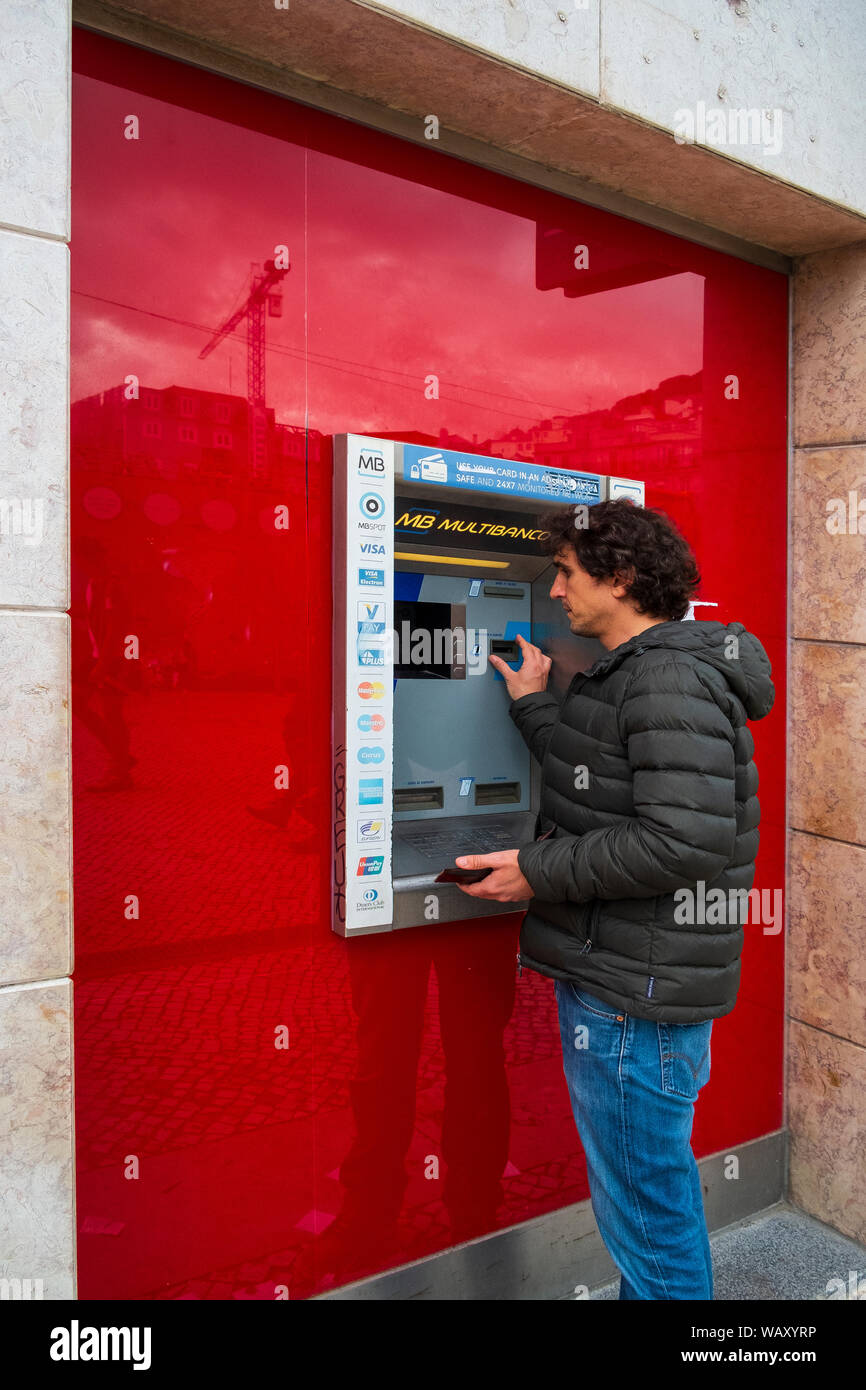 man at cash machine Stock Photo