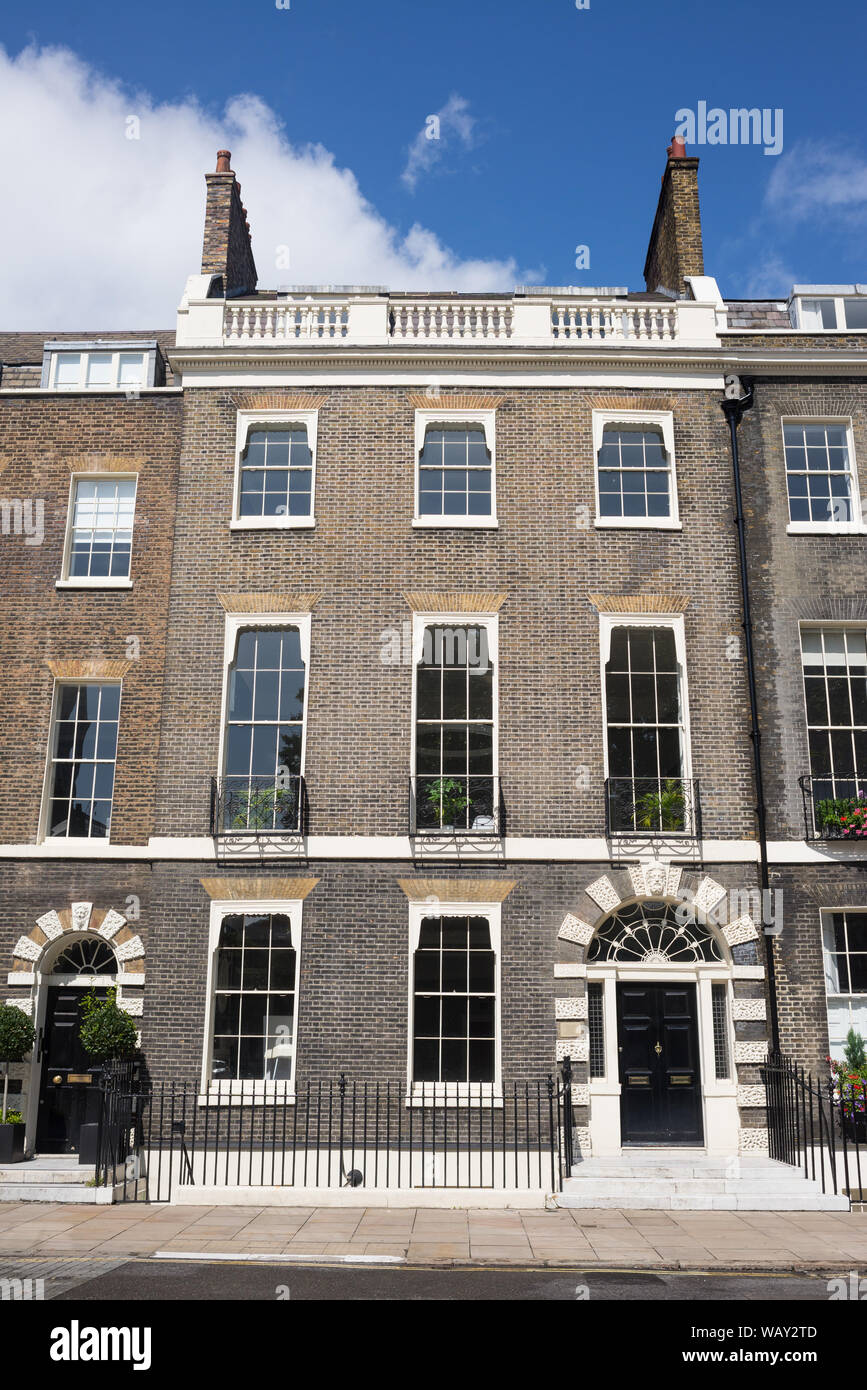 Facade of Georgian residential luxury three storeys town house in the exclusive Bloomsbury area in Central London. Stock Photo