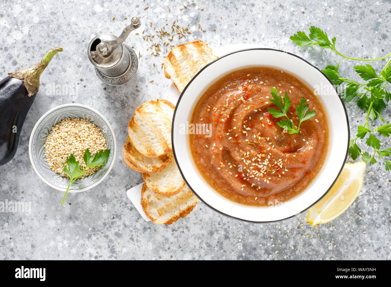 Eggplant hummus with ingredients for cooking. Traditional vegan arabic