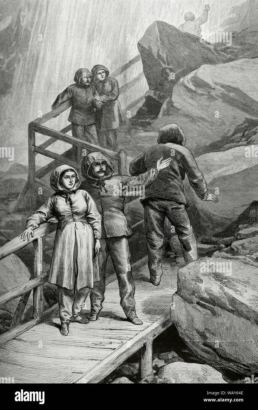 North America, United States. Visitors to the Niagara Falls, from the U.S. side. People dressed in the specific clothing that is used to make the visit, on the wooden platform that climbs around the rocks to the summit of the American waterfall (New York). Engraving. La Ilustracion Española y Americana, June 8, 1876. Stock Photo