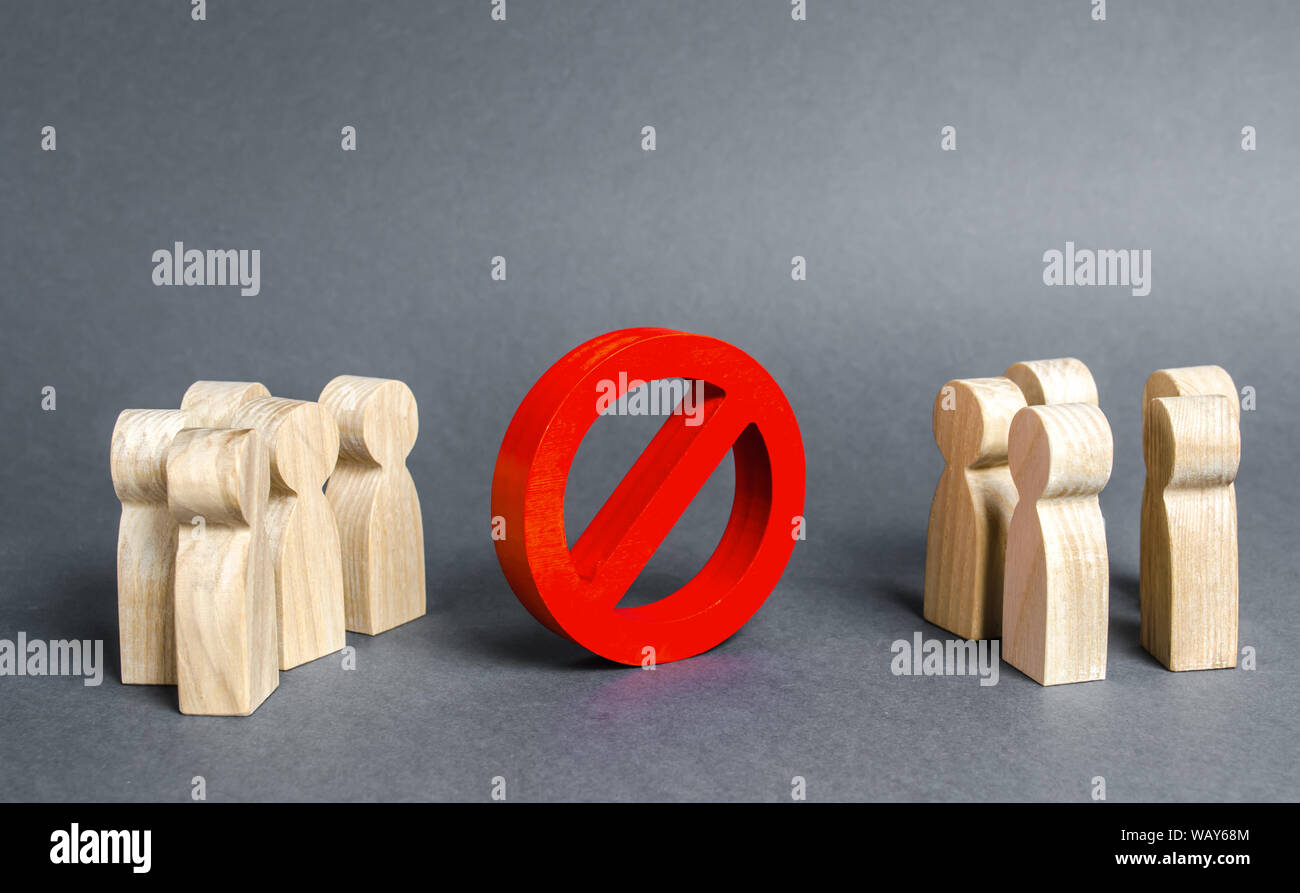 Two groups of people are divided by a red prohibition sign NO. prohibition, taboo, and rejection. Conservatism, misunderstanding new. Laws Restriction Stock Photo
