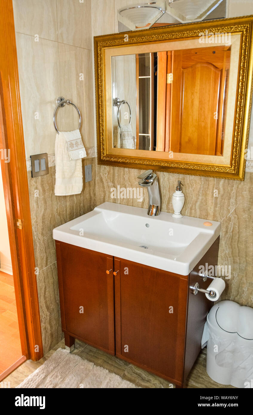 Hands wash-basin at the mirror in a bathroom of luxury house Stock ...