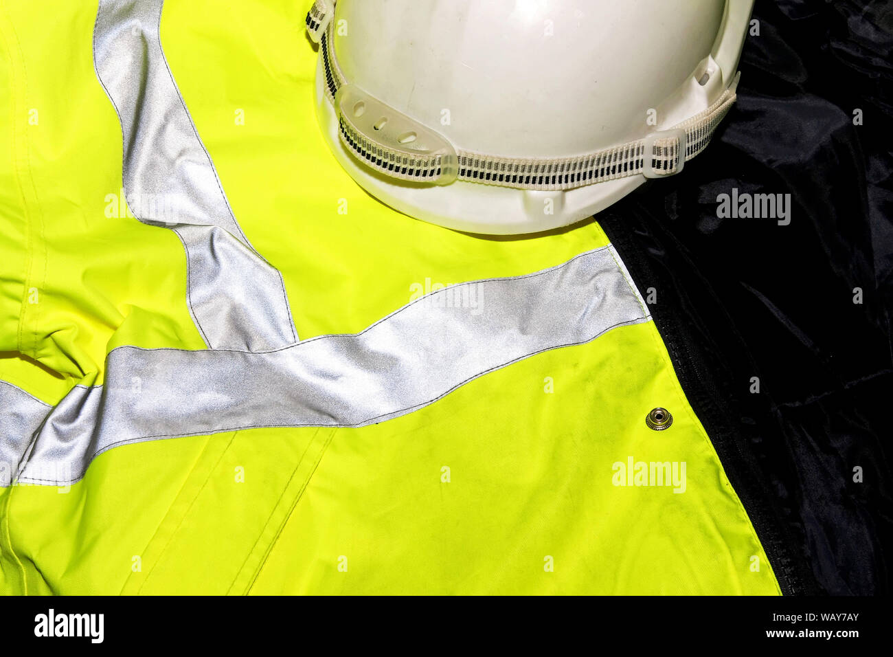 High reflective west and safety helmet for workers Stock Photo - Alamy