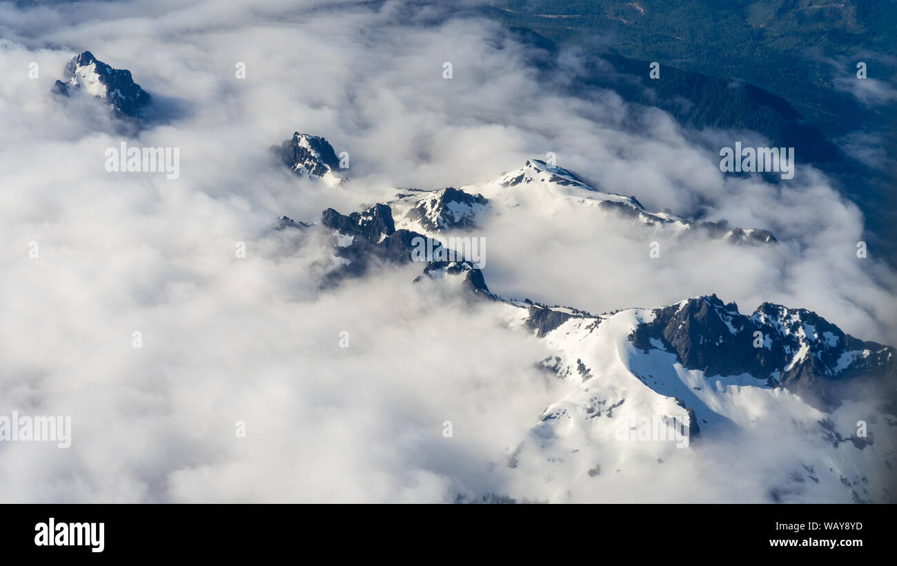 Central Cascades range from airplane on approach to Seattle, WA Stock Photo