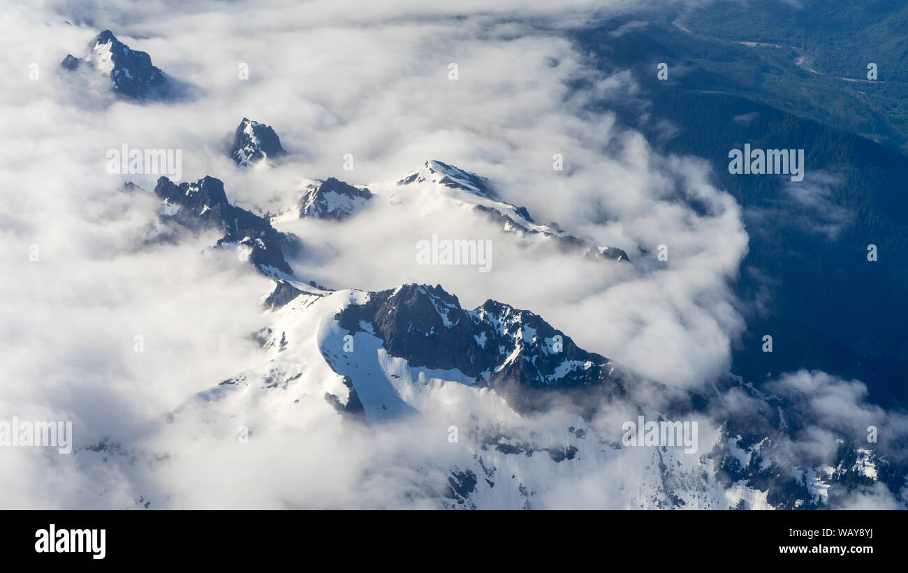 Central Cascades range from airplane on approach to Seattle, WA Stock Photo
