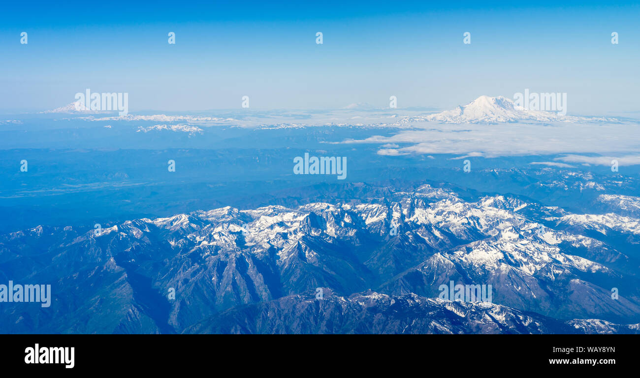 Three pacific northwest volcanoes from airplane Stock Photo