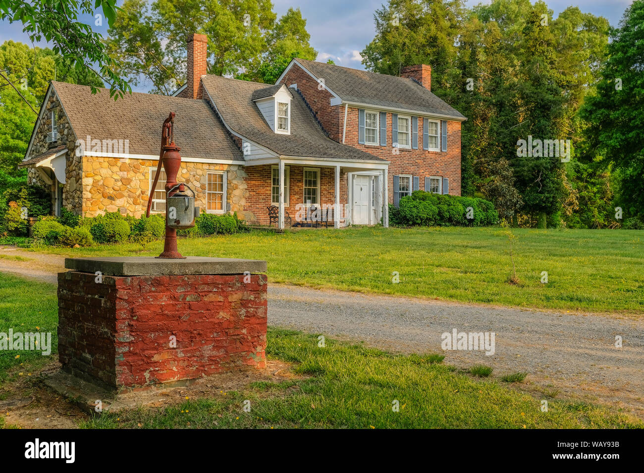 La Plata, Maryland, USA - May 11, 2018: Hand fountain in front of a stone farm surrounded by trees Stock Photo