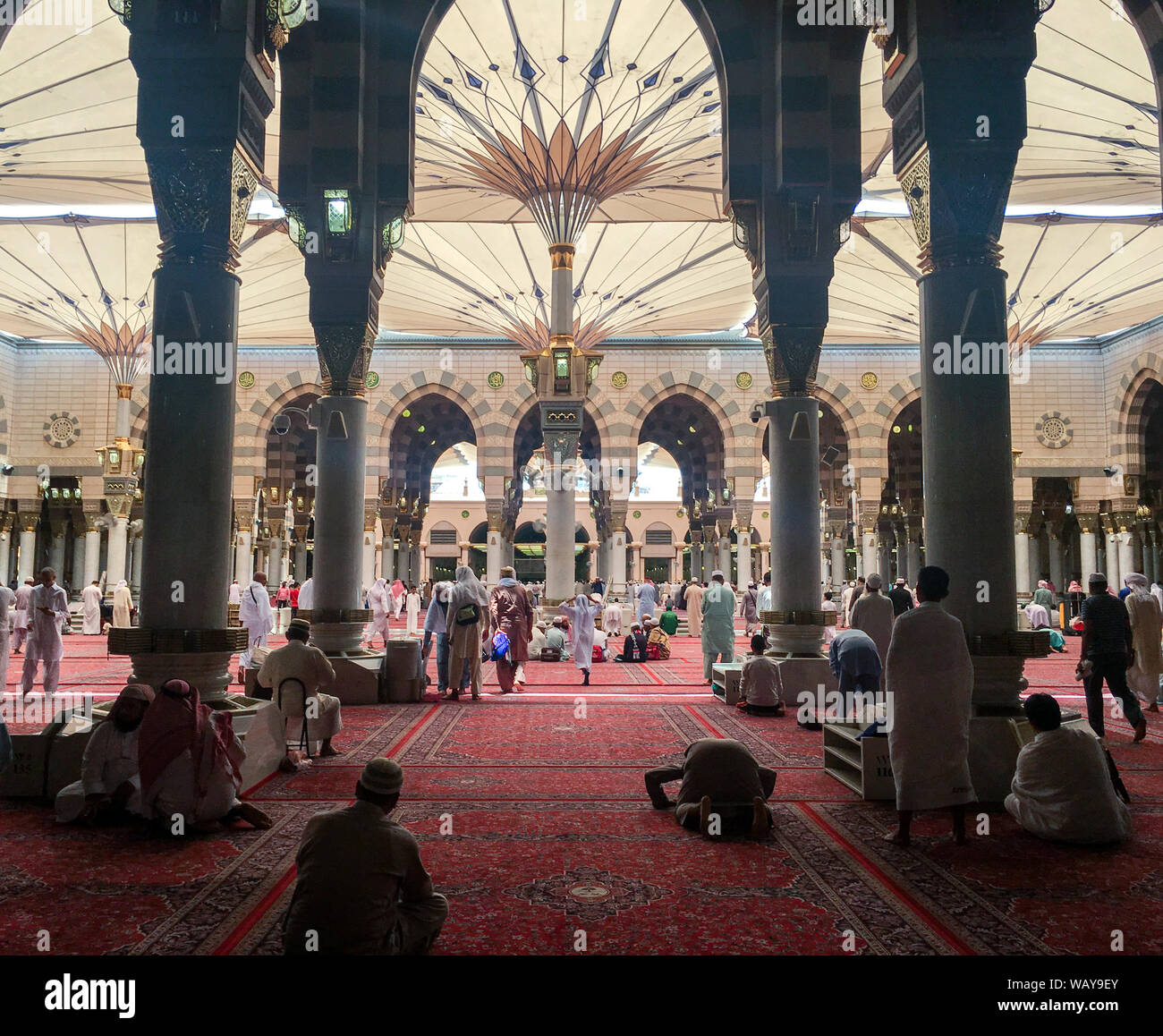 MEDINA, SAUDI ARABIA (KSA) - JUNE 25 : Muslims get ready to pray inside Nabawi Mosque June 25, 2019 in Medina, KSA. Beneath the green dome is where Pr Stock Photo