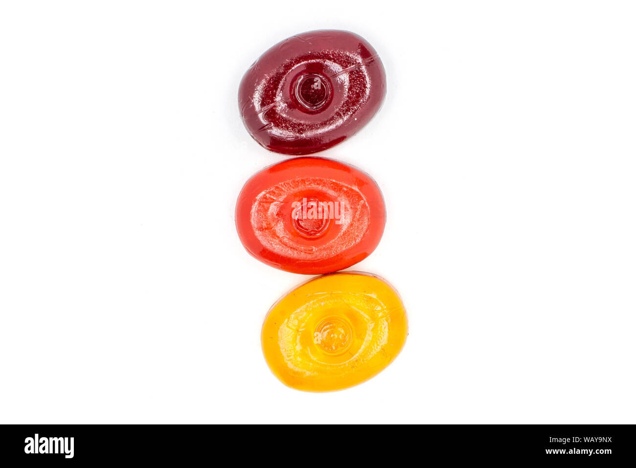 Group of three whole colourful hard candy flatlay isolated on white ...