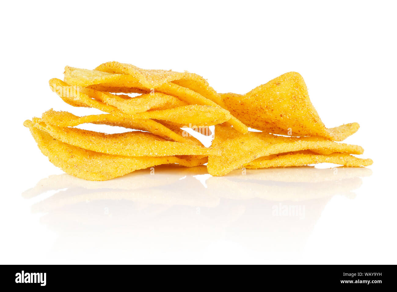 Lot of whole cheese tortilla chips heap isolated on white background