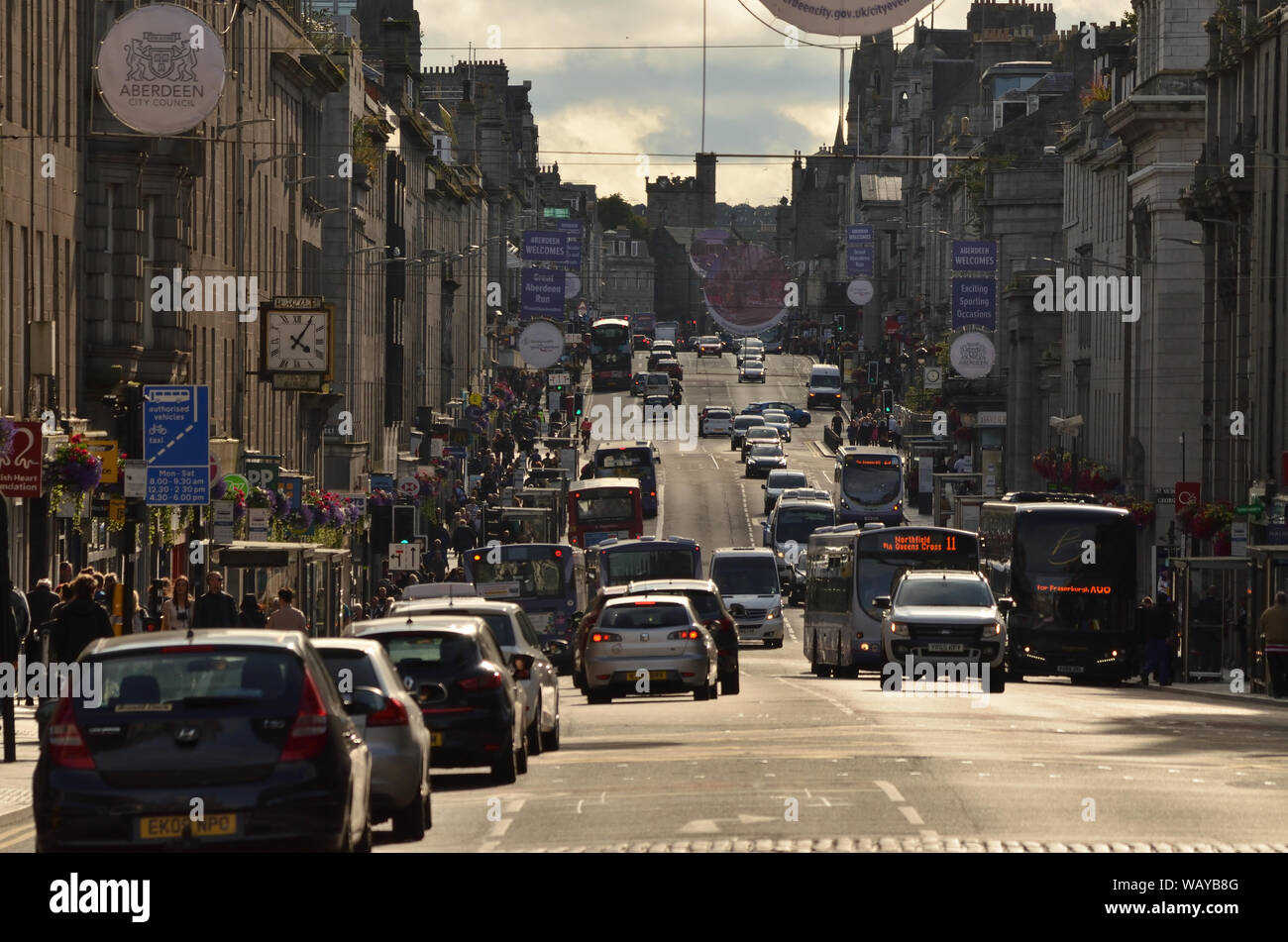 A typical busy British 'high street' scene in 2019 with shoppers and traffic on Union Street in Aberdeen city centre, Scotland. Stock Photo