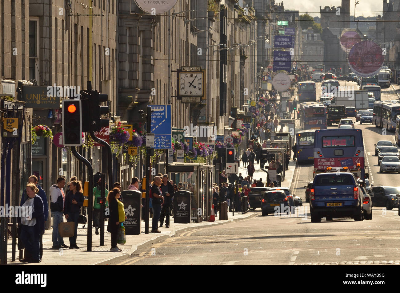 A typical British 'high street' scene in 2019 with shoppers and traffic on Union Street in Aberdeen city centre, Scotland. Stock Photo