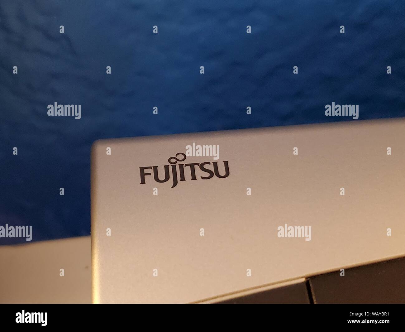 Close-up of logo for Japanese electronics company Fujitsu on consumer electronic device, August 22, 2019. () Stock Photo