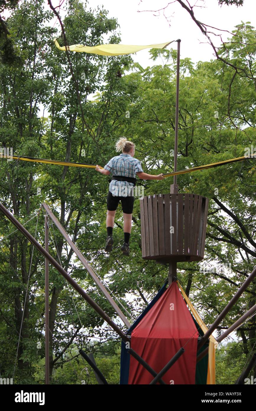 A thrilling trampoline carnival ride at the Bristol Renaissance Faire, feire, feyre, faire, and fayre, Mittelaltermarkt, Mercats Medievals. Stock Photo