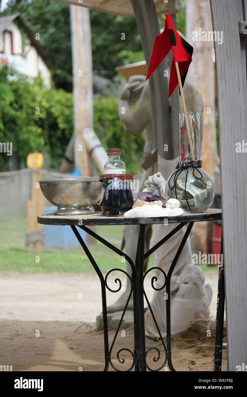 Tabletop full of potions and bowls and magic at the Bristol Renaissance Faire, feire, feyre, faire, and fayre, Mittelaltermarkt, Mercats Medievals. Stock Photo