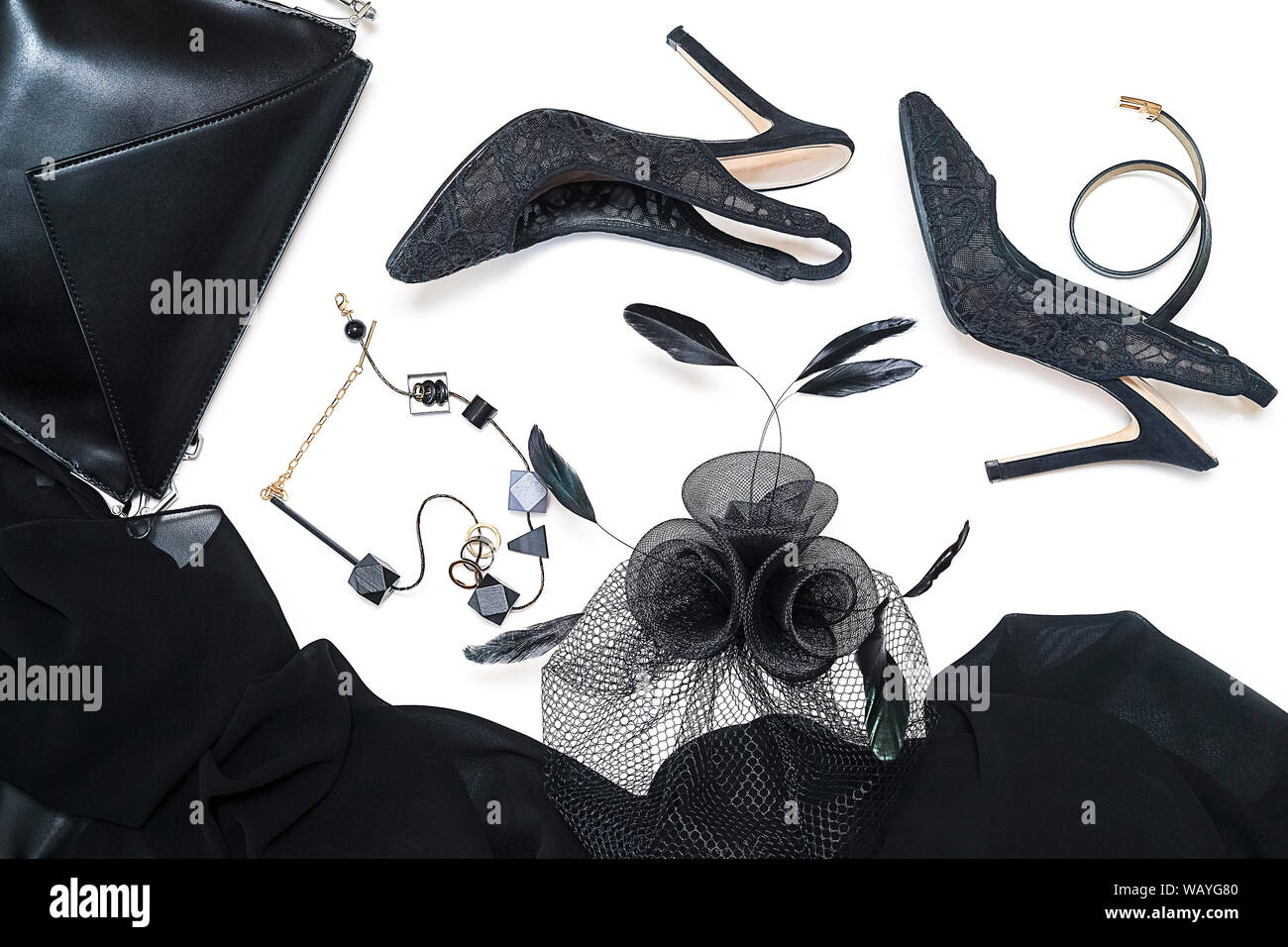 Halloween party female outfit collection accessories black on white background, shoes, cloth with skulls, jewelry, bag. Stock Photo