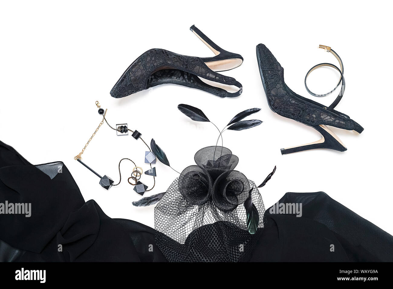 Halloween party female outfit collection accessories black on white background, shoes, cloth with skulls, jewelry, bag. Stock Photo