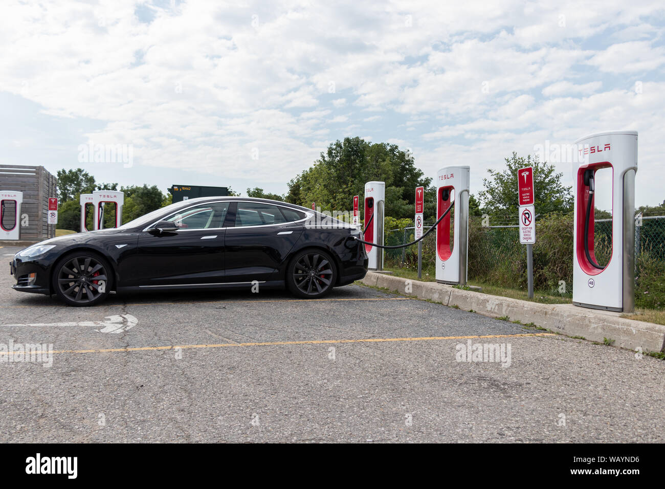 Black Tesla Model S parked and charging at Tesla Supercharger Station Stock Photo Alamy