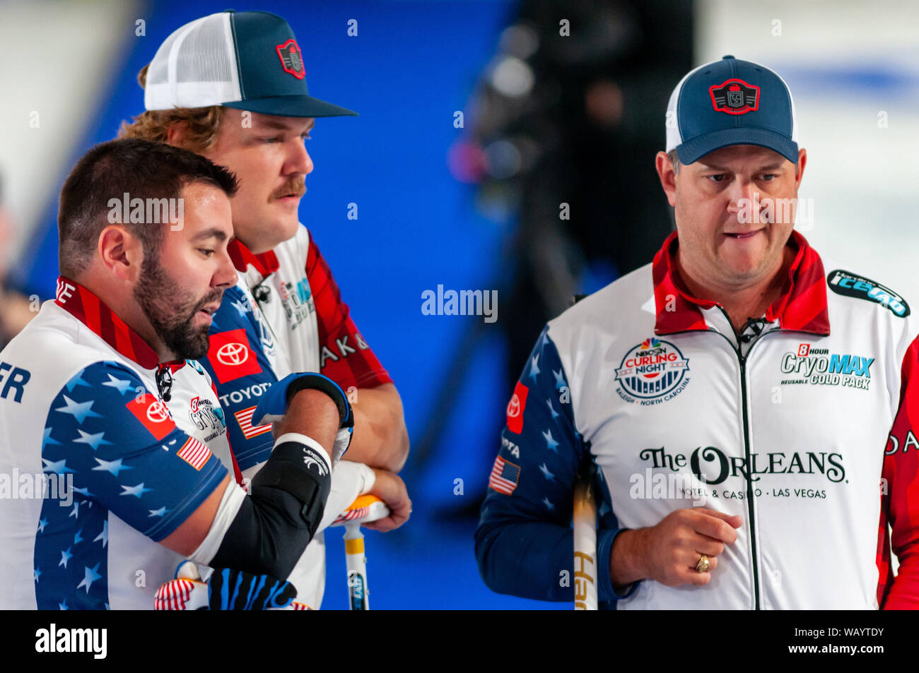 Raleigh, North Carolina, USA. 22nd Aug, 2019. Aug. 22, 2019 Ã RALEIGH, N.C., US - JOHN LANDSTEINER, MATT HAMILTON, and JOHN SHUSTER of the United States in action during Curling Night in America at the Raleigh Ice Plex. Curling Night in America featured members of the U.S. Olympic menÃs gold medal team from the 2018 Winter Olympics in South Korea U.S. womenÃs team, as well as teams from Italy, Japan, and Scotland, Aug. 22-24, 2019. Credit: Timothy L. Hale/ZUMA Wire/Alamy Live News Stock Photo
