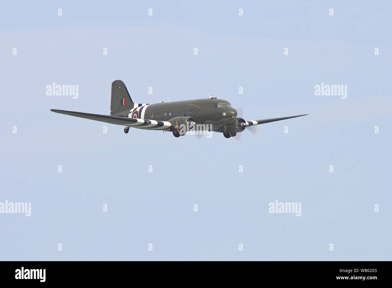 A Dakota C-47 of the Battle of Britain Memorial Flight makes a pass along the seafront at Eastbourne's International Airshow, (Airbourne). T Stock Photo