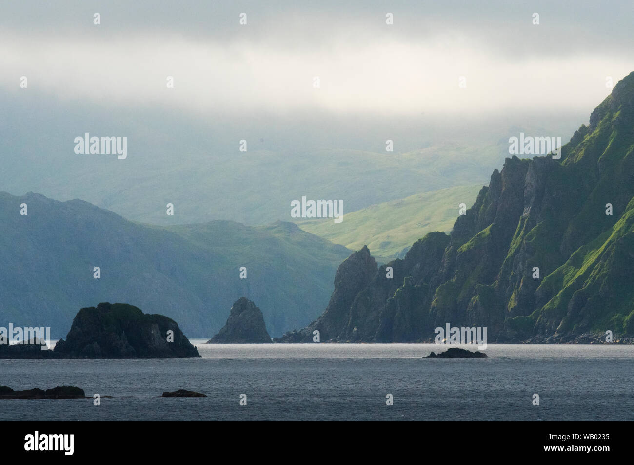 Summer fog over Sweeper Cove, Adak Island, Aleutian Islands, Alaska Stock Photo