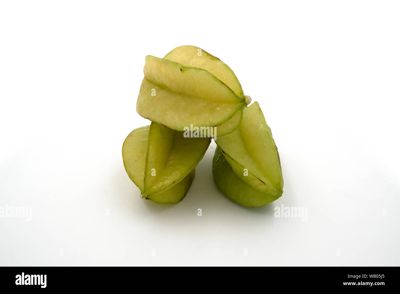 Fresh star fruits isolated on white background. Healthy green fruits. Tropical fruit. Stock Photo