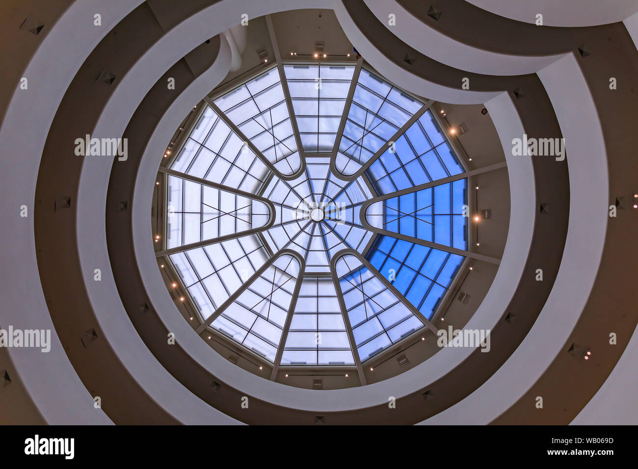 Inside one of the most impressive famous modernist masterpieces of Frank Lloyd Wright, the Guggenheim Museum, winding staircase with glass rooftop Stock Photo