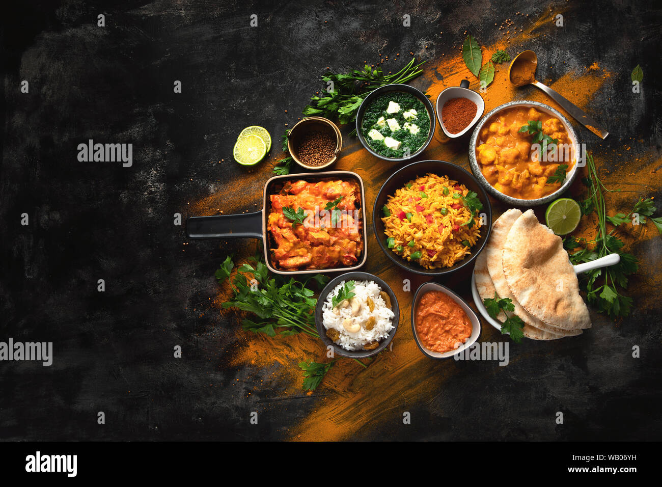 Assorted indian food on black background.. Indian cuisine. Top view with  copy space Stock Photo - Alamy
