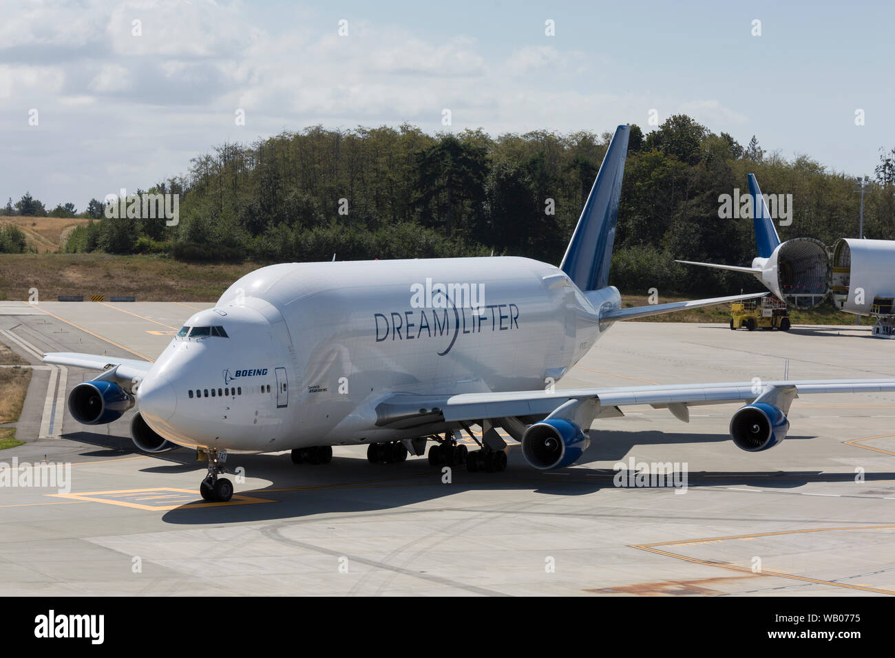 A Dreamlifter taxis into position for takeoff at the Dreamlifter Operations Center at Paine Field in Everett, Washington on August 22, 2019. The wide-body cargo aircraft is a modified Boeing 747-400 used to transport components of the Boeing 787 Dreamliner. Stock Photo