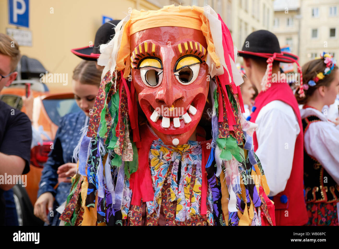 Portrait of Polish Folklore costume and mask devilish performer start of the Parade of Etnovyr Festival in street of Lviv. Lviv, Ukraine - August 2019 Stock Photo