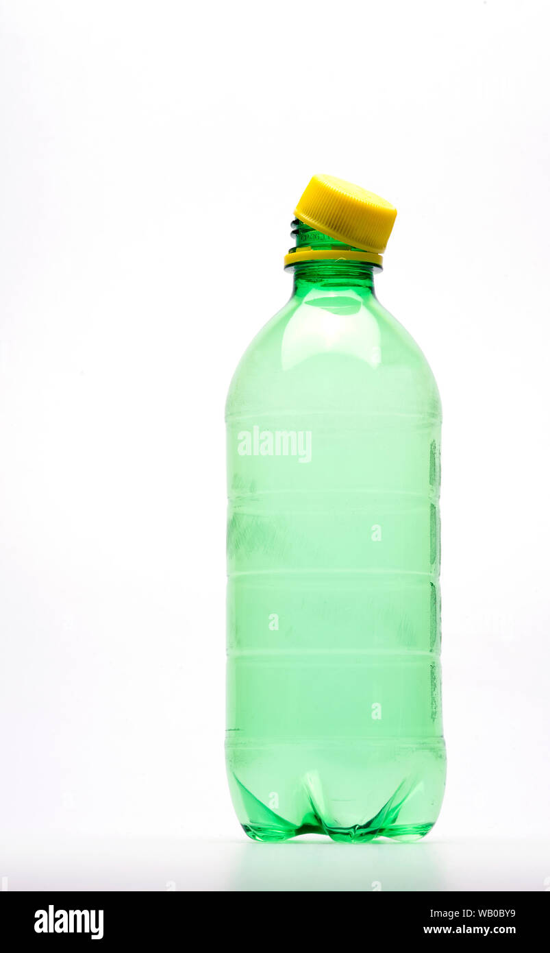 Green Plastic bottle with yellow in isolated background Stock Photo - Alamy