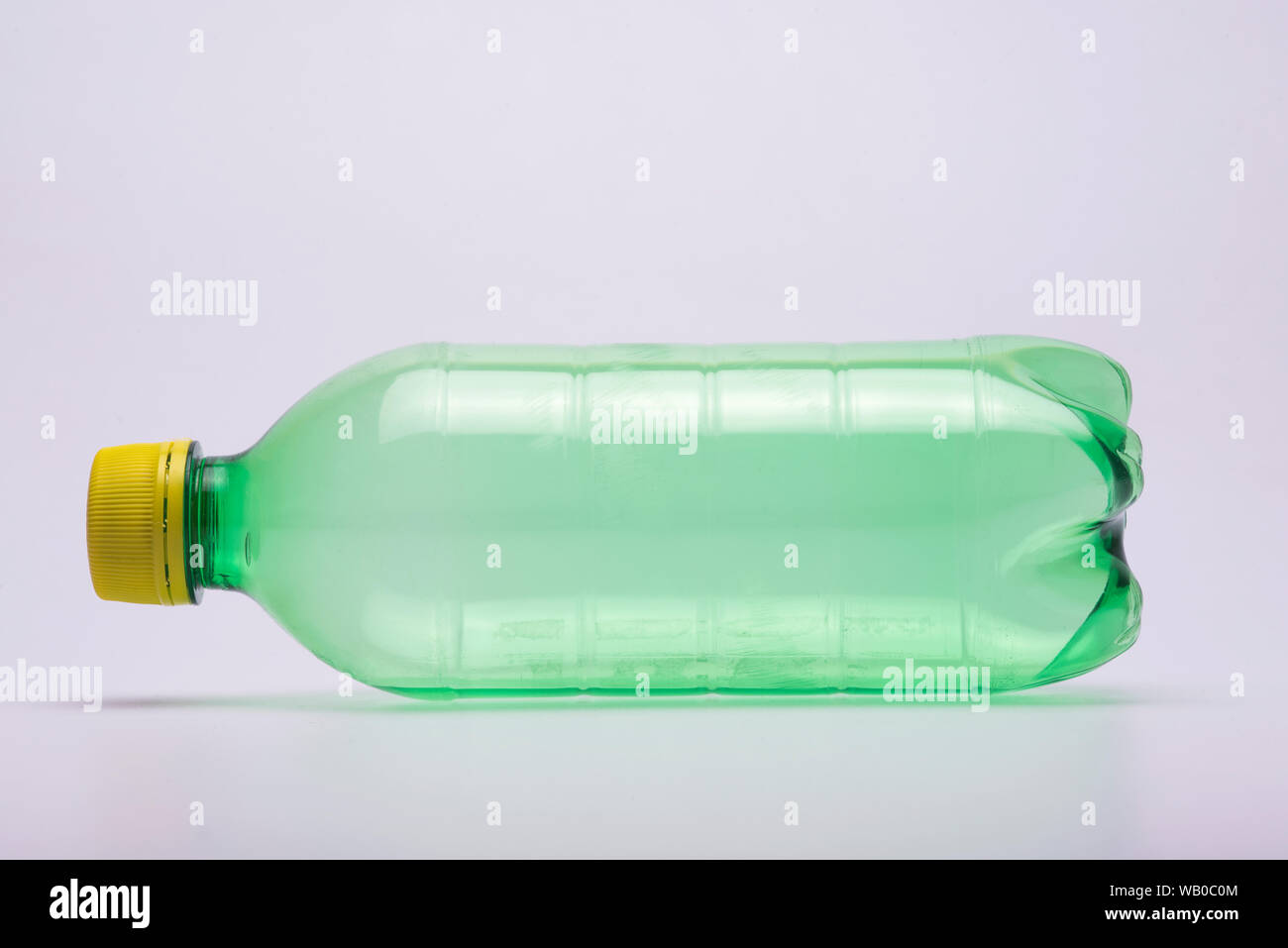 Download Green Plastic Bottle With Yellow Cap In Isolated Background Stock Photo Alamy PSD Mockup Templates