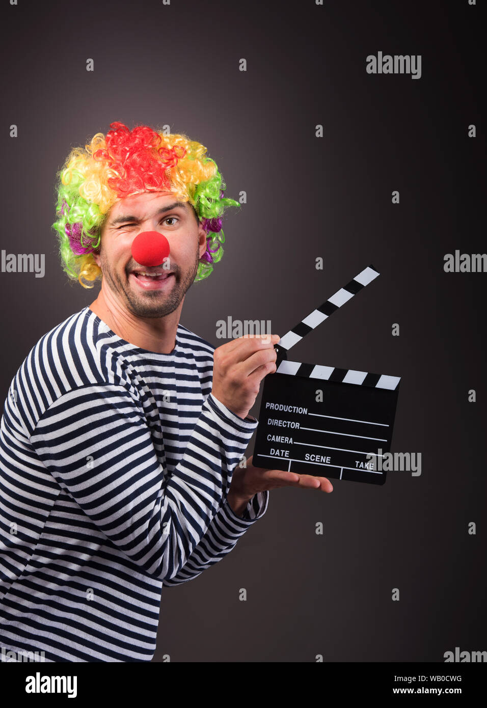 Funny clown with clipper box. Studion shot Stock Photo Alamy