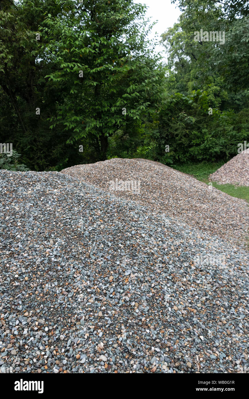 Stone aggregate, Stack of Gray Gravel, Coarse Loose Stones. Stock Photo