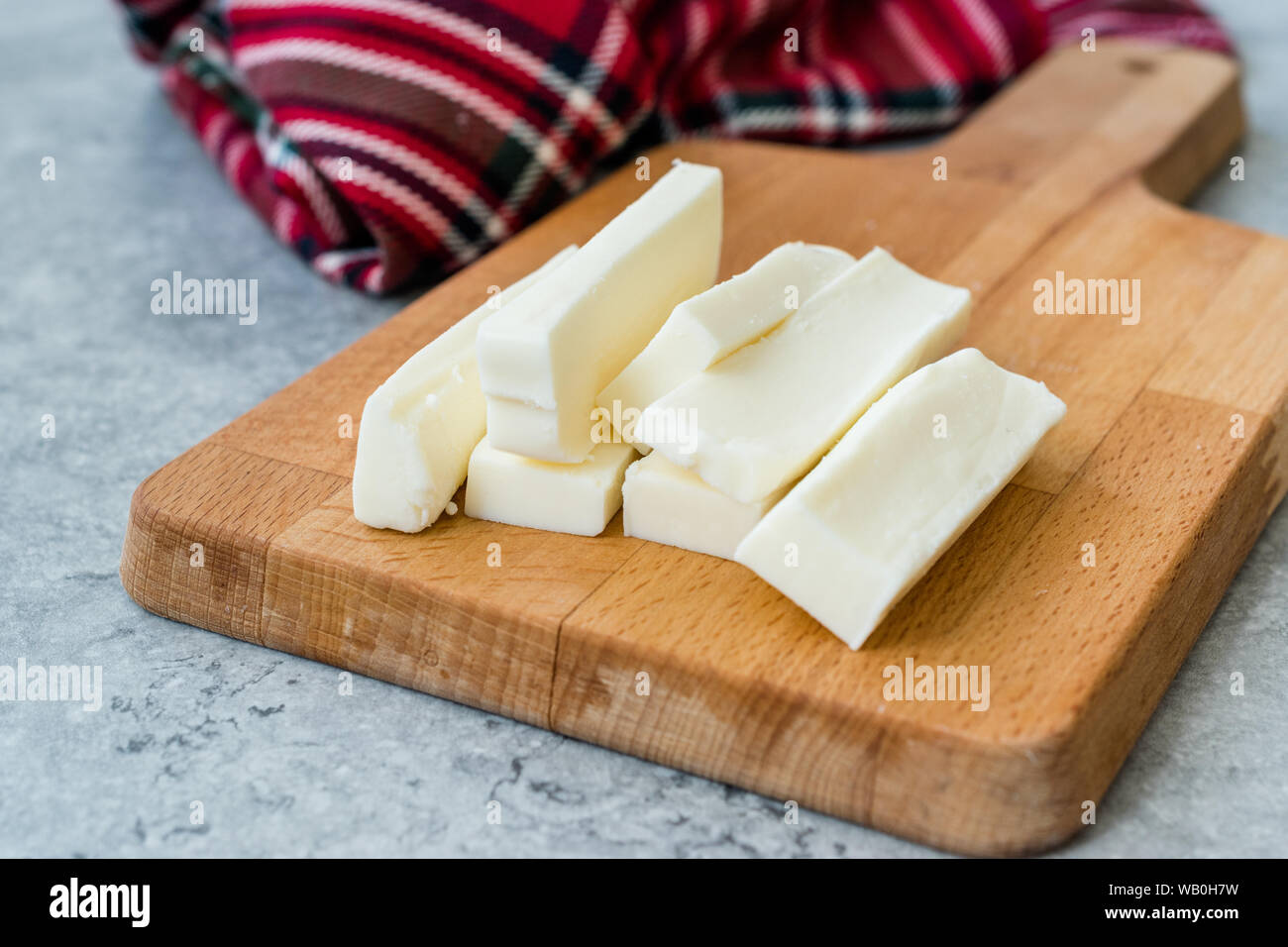 String Cheese Slices for a Snack / Turkish Dil Peyniri. Traditional Organic Food. Stock Photo