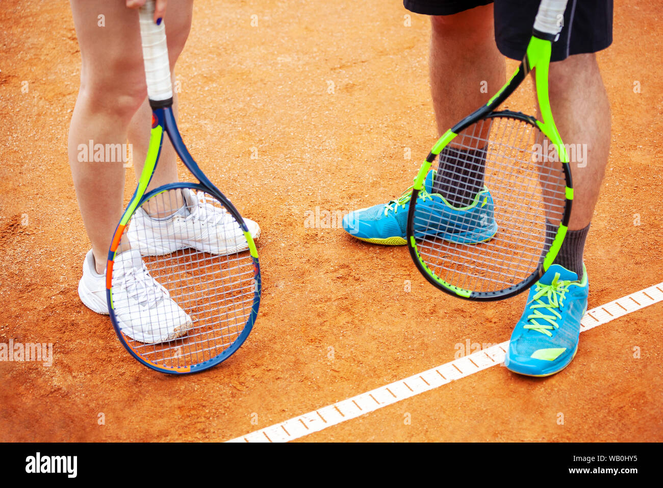 Closeup of tennis players holding rackets ready to play tennis. Stock Photo