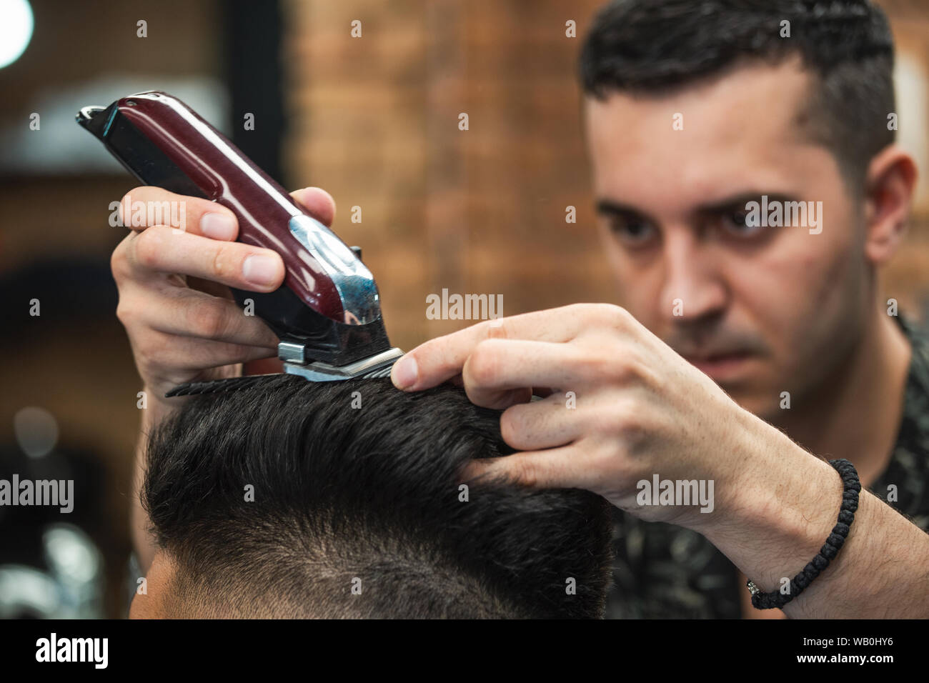 Close Up Shot Of Man Getting Trendy Haircut At Barber Shop Male