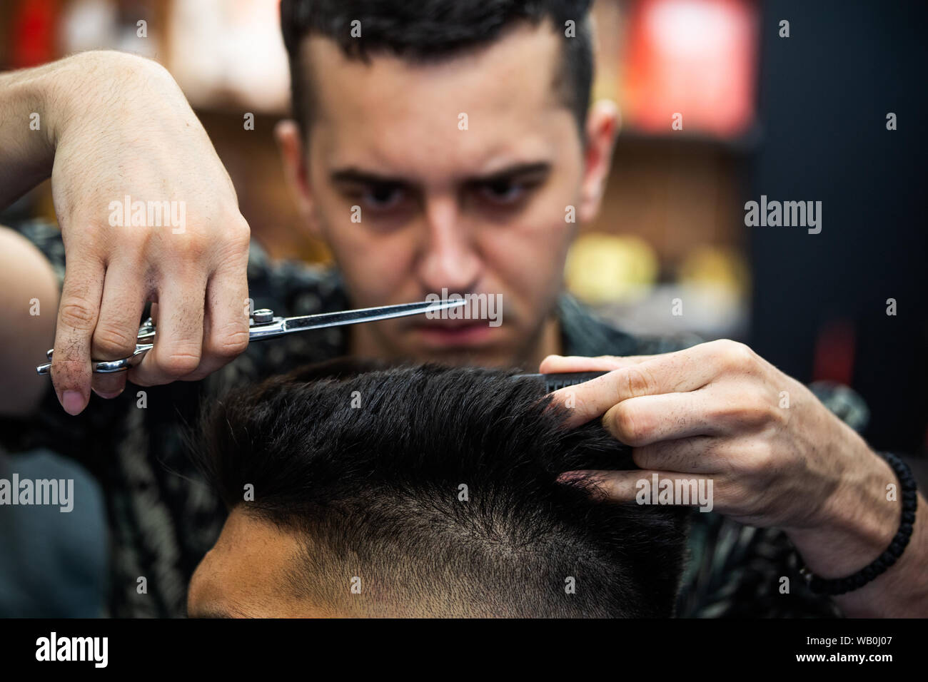 Barbershop Close Up Of Man Haircut Master Does The Hair Styling
