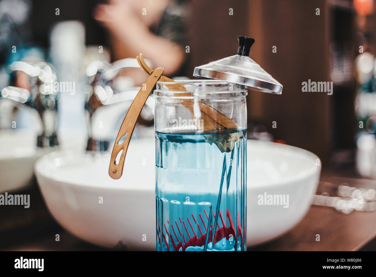 Razor in Barbicide Disinfecting Jar at barber shop Stock Photo Alamy