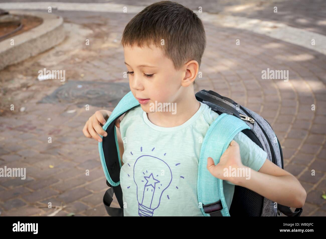 Cute 7 year old Caucasian child laughing, expecting to go to school for ...