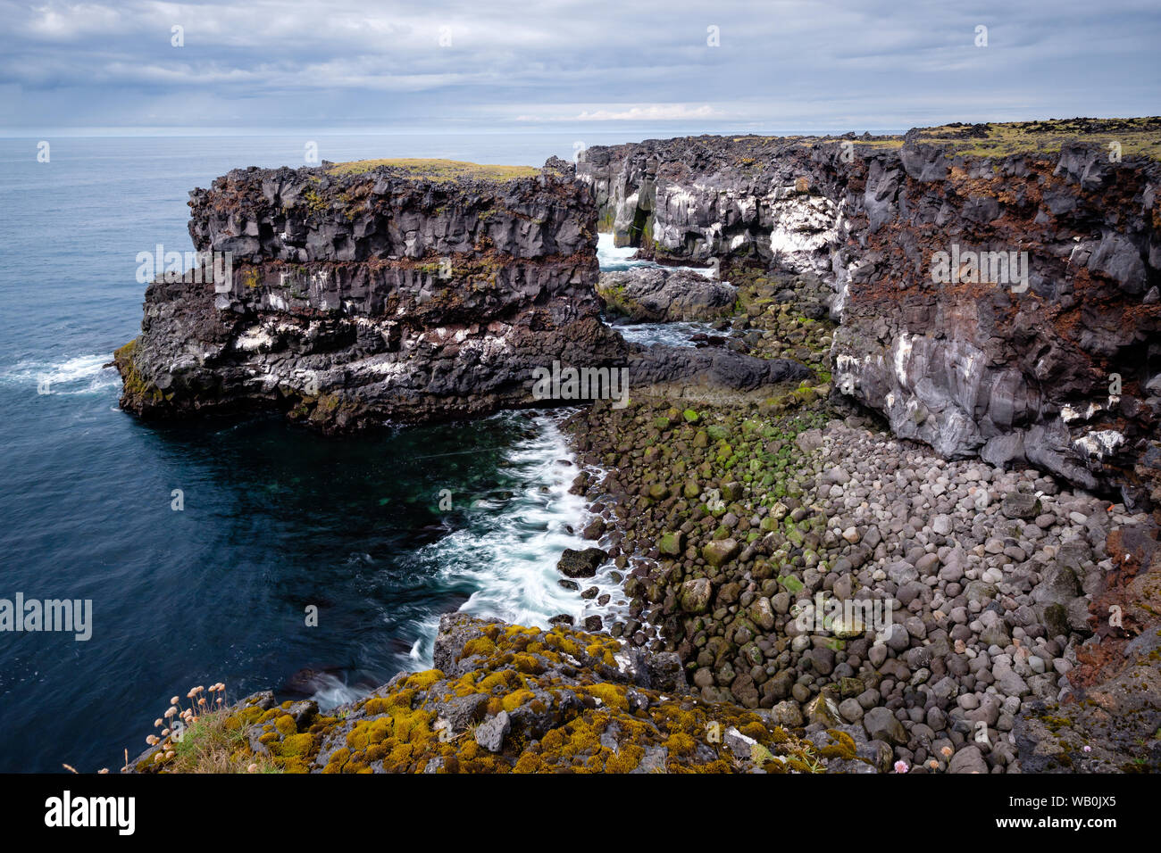 Dramatic view of steep rocky coast line bluff at Snaefellsnes; Iceland Stock Photo