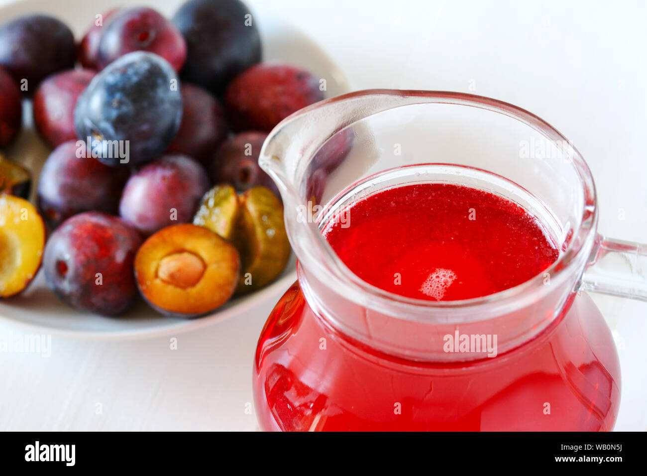 Plum compote. A healthy compote cooked with fresh purple plums. Natural