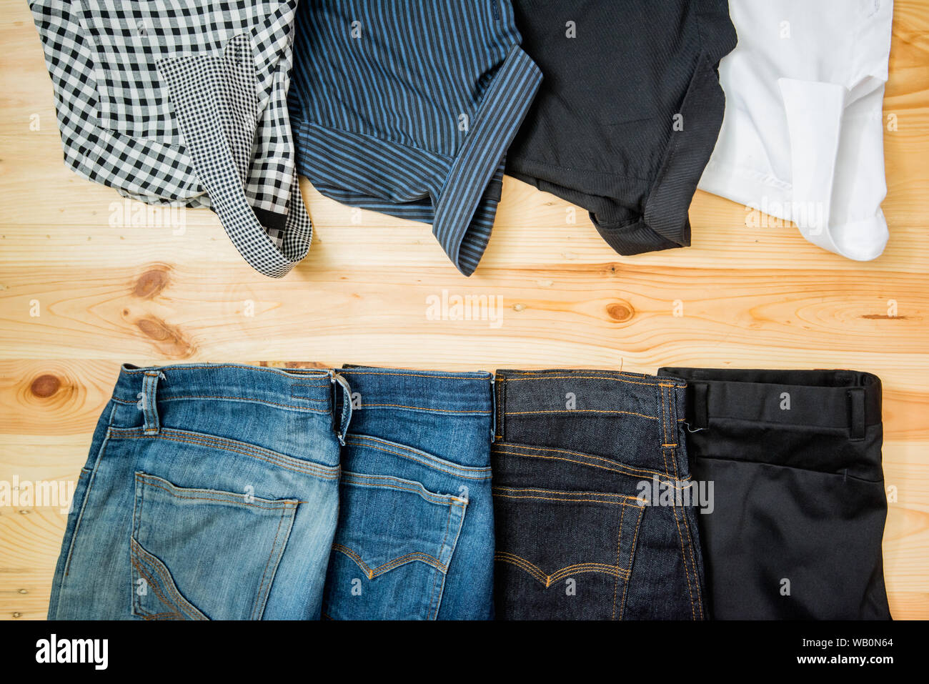 man casual outfits fashion accessories wooden table, jeans Stock Photo