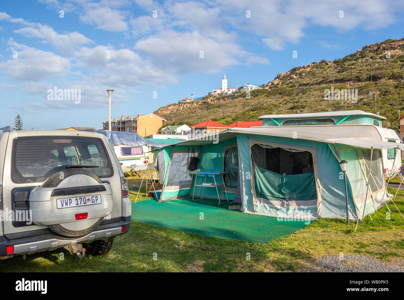 Mossel Bay, South Africa - camping at the Punt caravan park at this family holiday destination with the Cape St Blaize lighthouse in the background Stock Photo