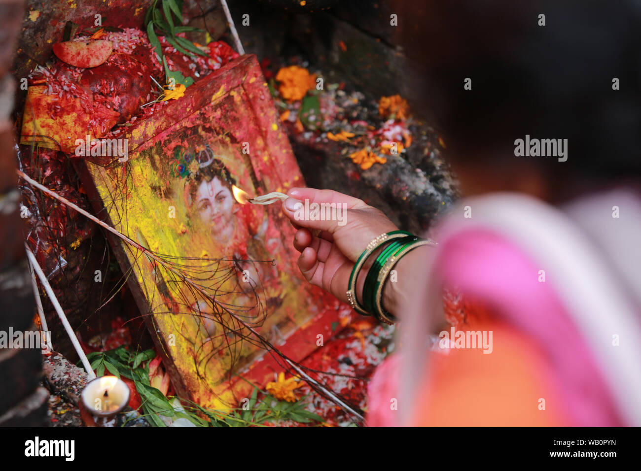 Kathmandu, Nepal. 23 Aug, 2019.Nepalese Hindu devotees celebrate Krishna Janmashtami by offering ritual prayers at Krishna temple in Patan, Nepal. Krishna anmashtami mark the birthday of Lord Krishna . Sarita Khadka/Alamy Live News Stock Photo