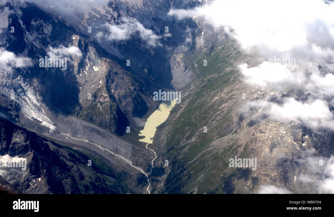 Aerial view of glacier and high alpine lake Stock Photo